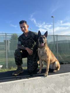 Marc-Anthony Burgos with his Military Working Dog